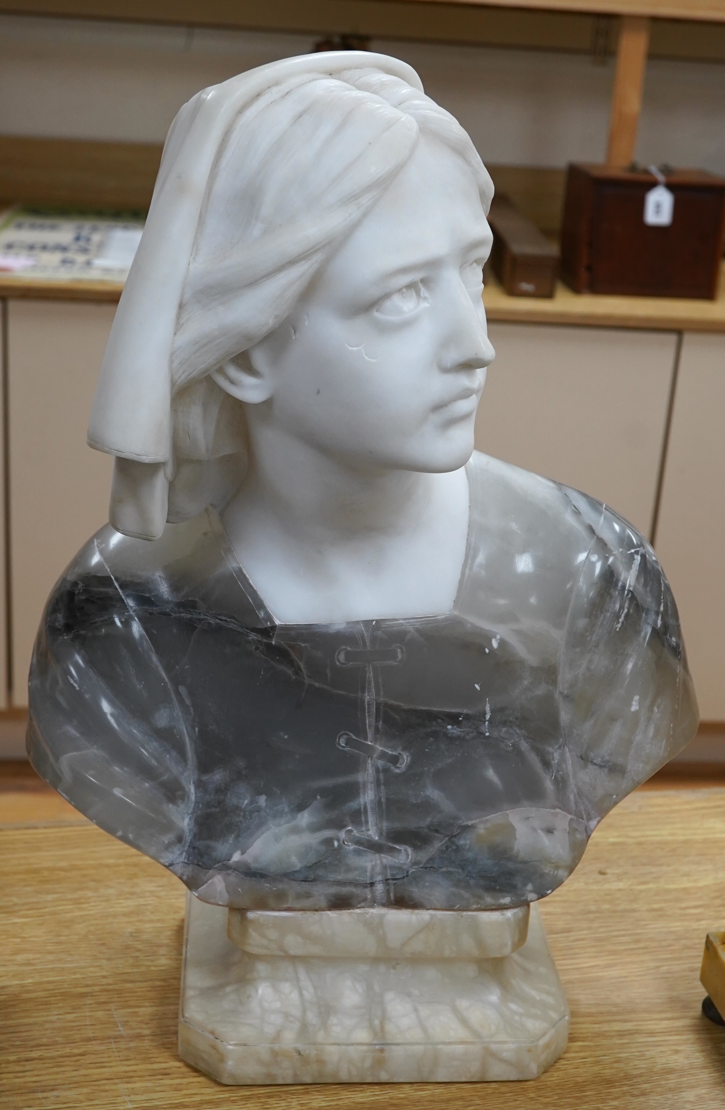 A French variegated alabaster bust of a young woman, 47cm high. Condition - scratch to top side of left cheek